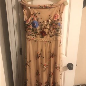 Off shoulder embroidered dress.